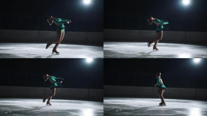 花样滑冰中美丽的旋转元素，运动女孩在黑暗中的溜冰场上表演，单人滑冰运动中的训练和示范表演