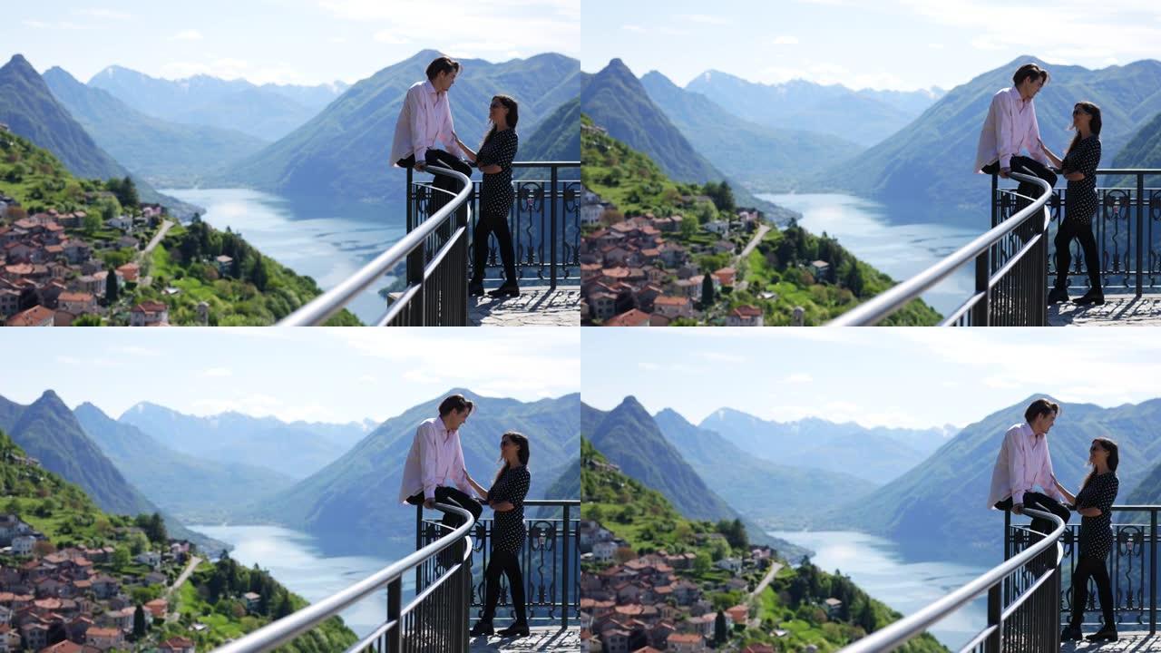 年轻夫妇一起欣赏湖泊和山脉的景色，调情