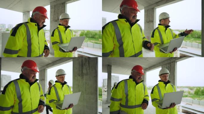 带笔记本电脑和工头戴着安全帽的土木工程师正在检查在建建筑