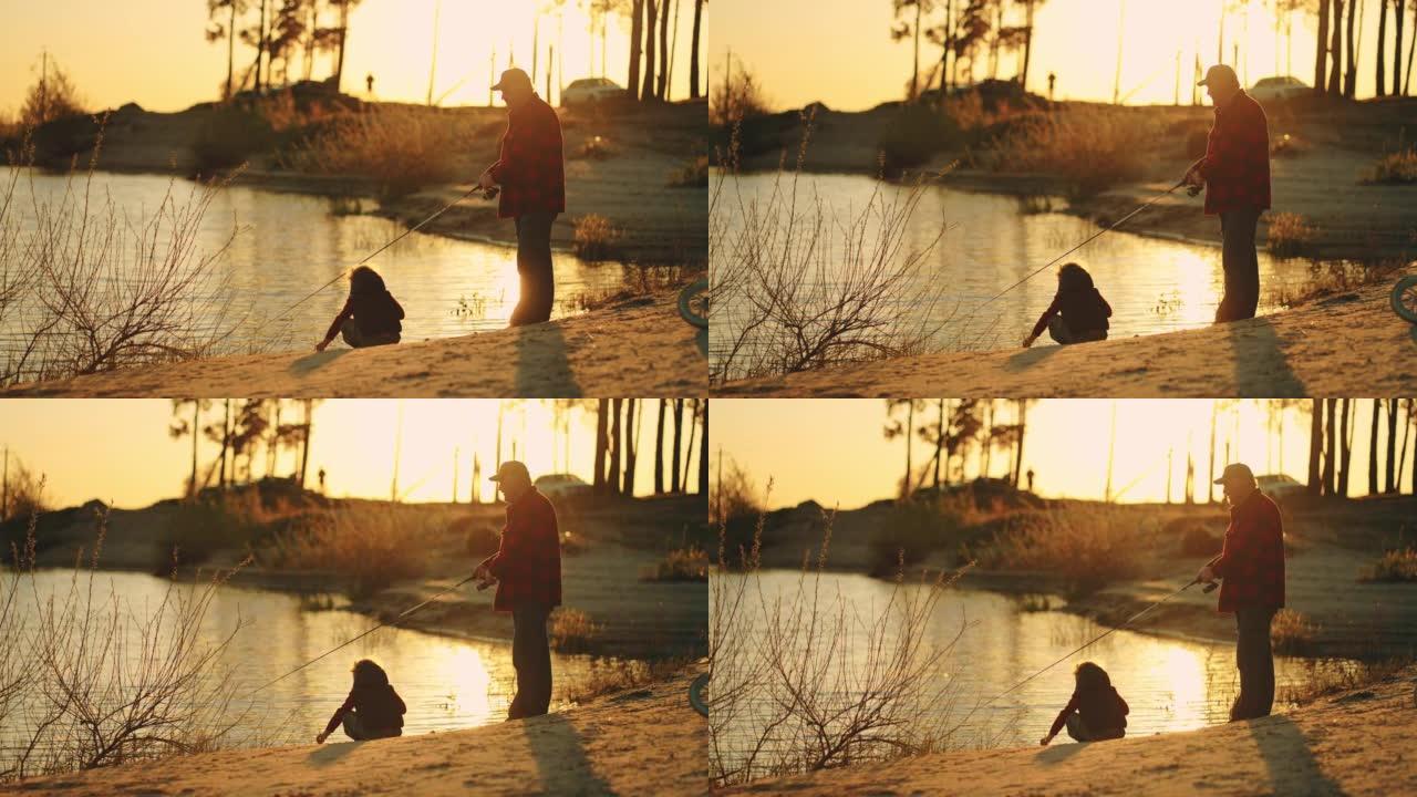 老渔夫和小男孩在湖岸或河边消磨时光，家庭在日落时分钓鱼