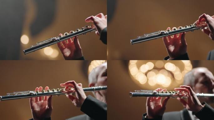 交响乐团音乐会，长笛手中的长笛特写，老歌剧院或现代音乐厅