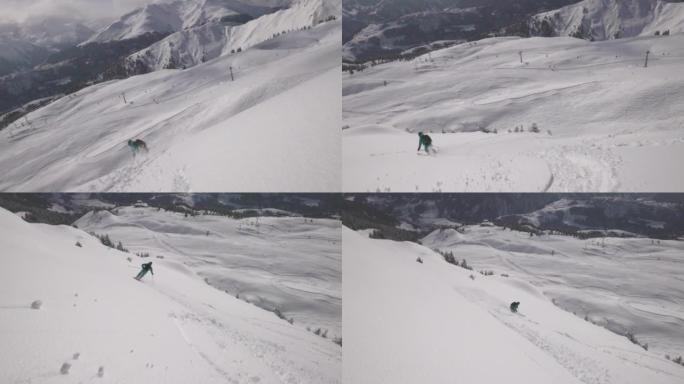 一名滑雪者从白雪皑皑的山坡上下来拍摄后