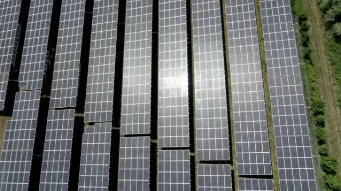 在野外拍摄太阳能电池板的空中无人机
