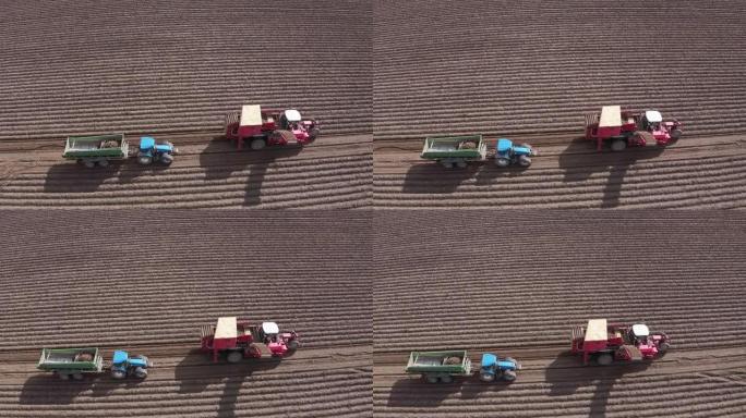 农业机械在耕田上移动。收获土豆。无人机的观点