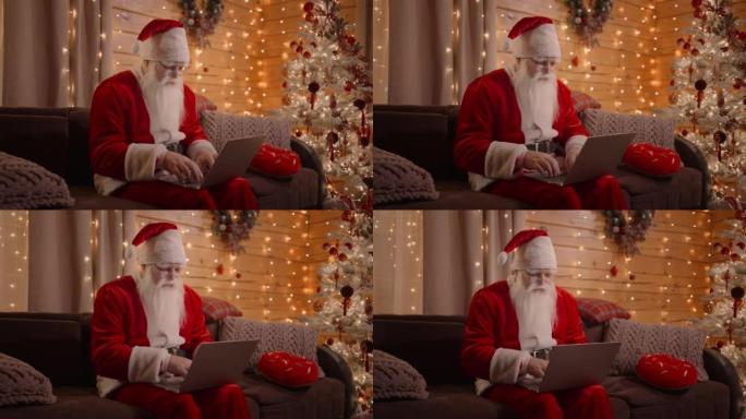 圣诞老人回复电子邮件，浏览互联网银行并在笔记本电脑上工作