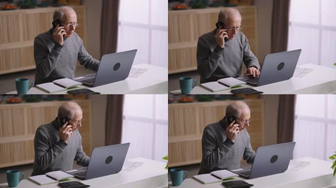 老人在冠状病毒大流行期间在家远程工作，老人正在使用笔记本电脑并通过电话打电话