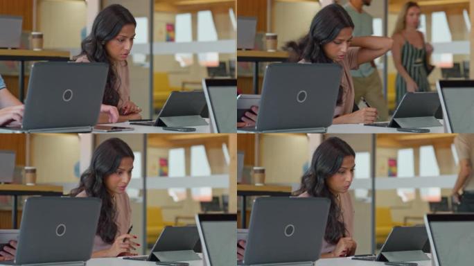 LD年轻女子在办公桌前工作，并在平板电脑上进行视频会议