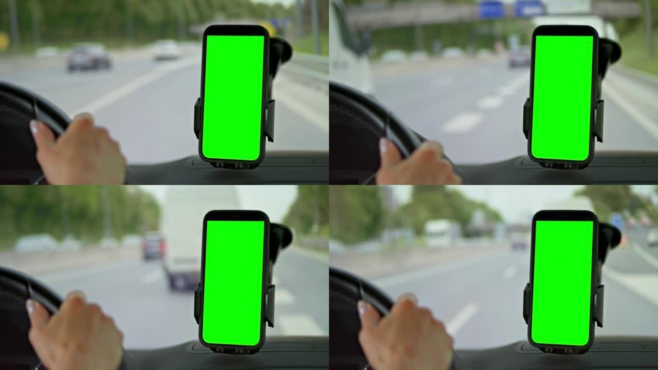 LD女人在智能手机上导航时在高速公路上行驶