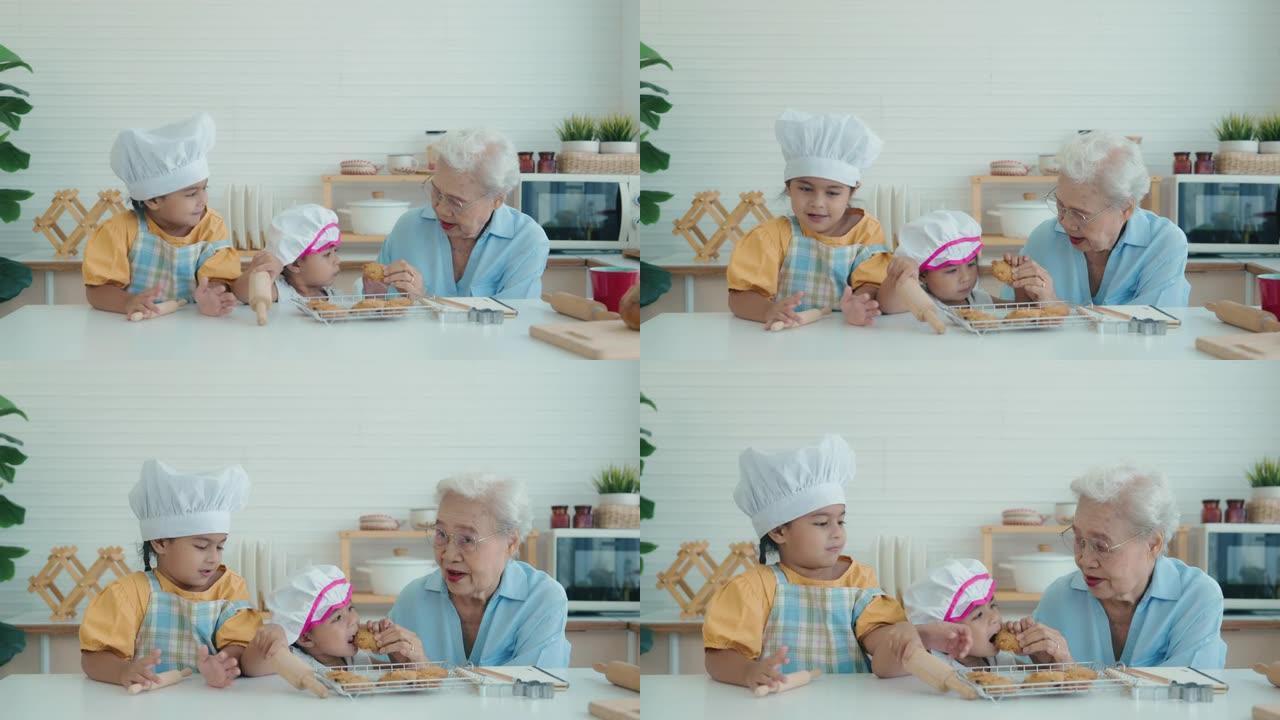 祖母和孙女互相帮助在厨房做面包