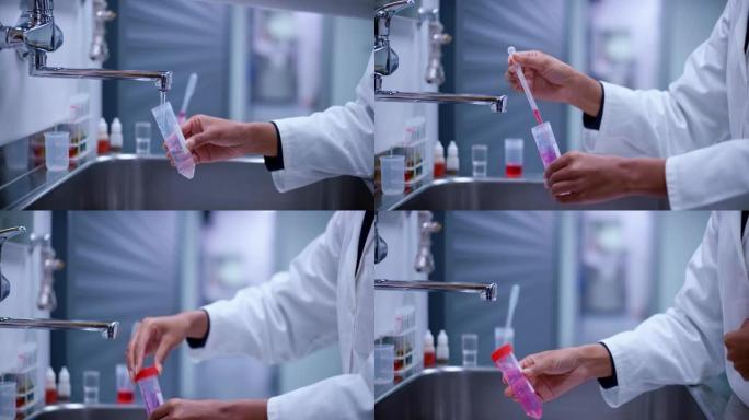 生物学家抽取自来水样本，加入试剂后摇动小瓶