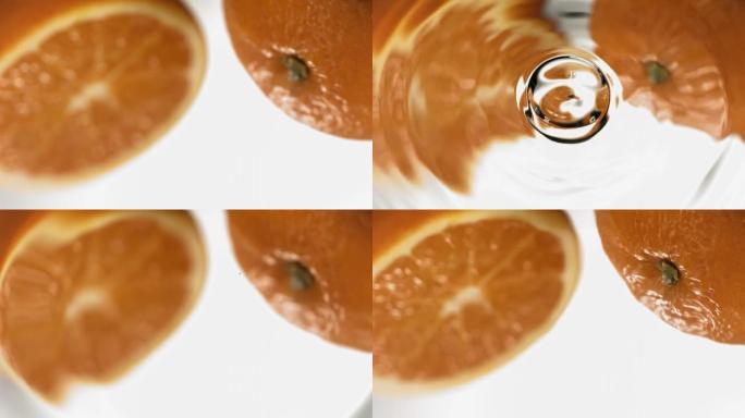 水滴落在镜子橙色上的超慢动作微距拍摄