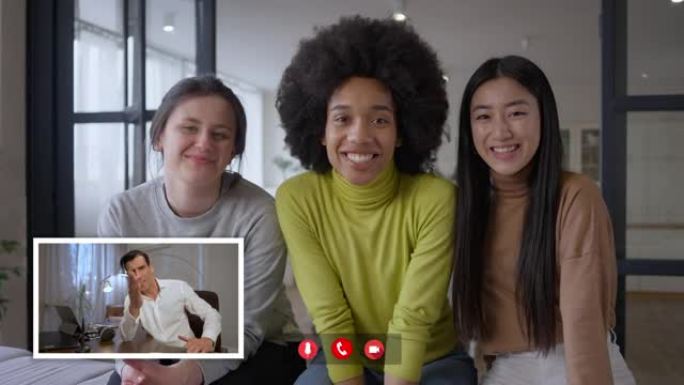 自信的男人在视频聊天中鼓掌，因为多种族女性为商业创业成功而欢欣鼓舞，微笑着看着网络摄像头。跨国团队在