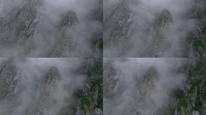 空中无人机拍摄薄雾笼罩的山腰