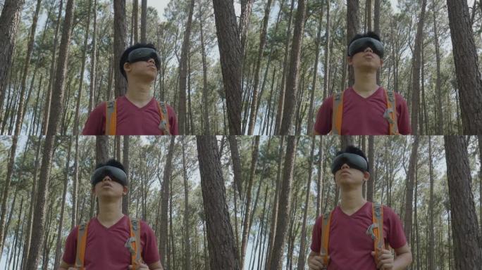 在松林环境中使用虚拟现实眼镜移动头部的旅行者肖像。人与元宇宙小玩意概念