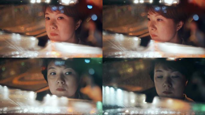 雨天晚上开车的女人