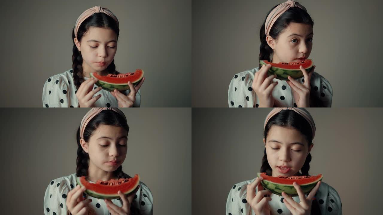 时尚女孩吃新鲜西瓜的肖像