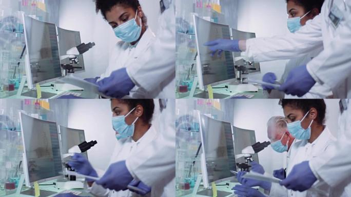 成熟的科学家阅读笔记。非洲，女医生在背景测试DNA样本。