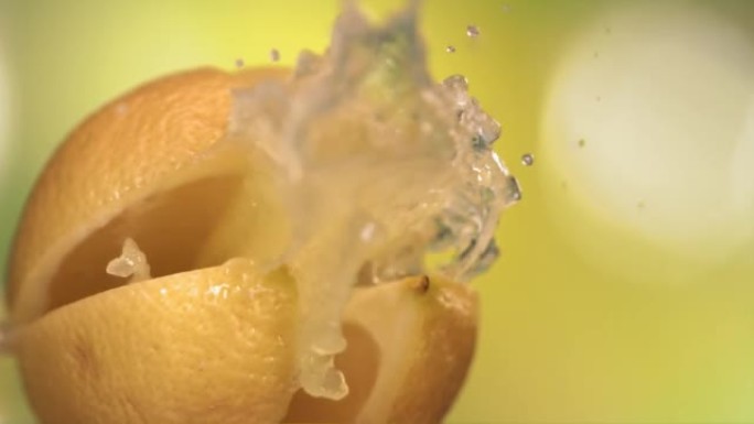 Fresh Lemon fruit squirting with juice in slow mot