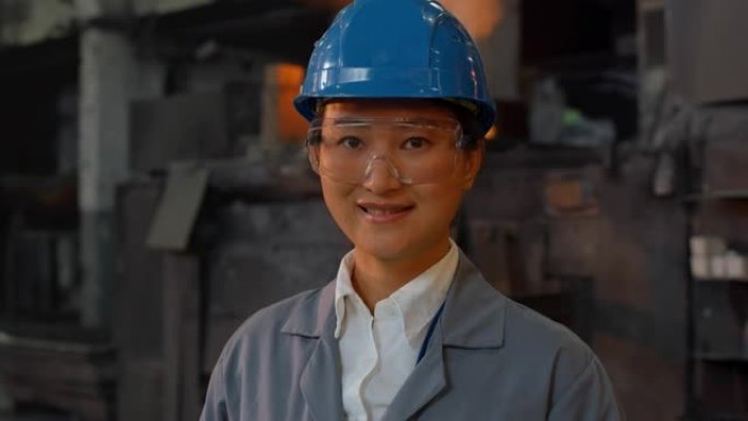 站在铸造厂的一位女工程师的DS肖像