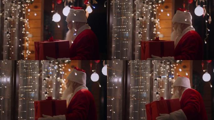 一个真正的圣诞老人戴着眼镜，在户外留着胡须，在圣诞节前一天晚上带着礼物来到房子的窗户上