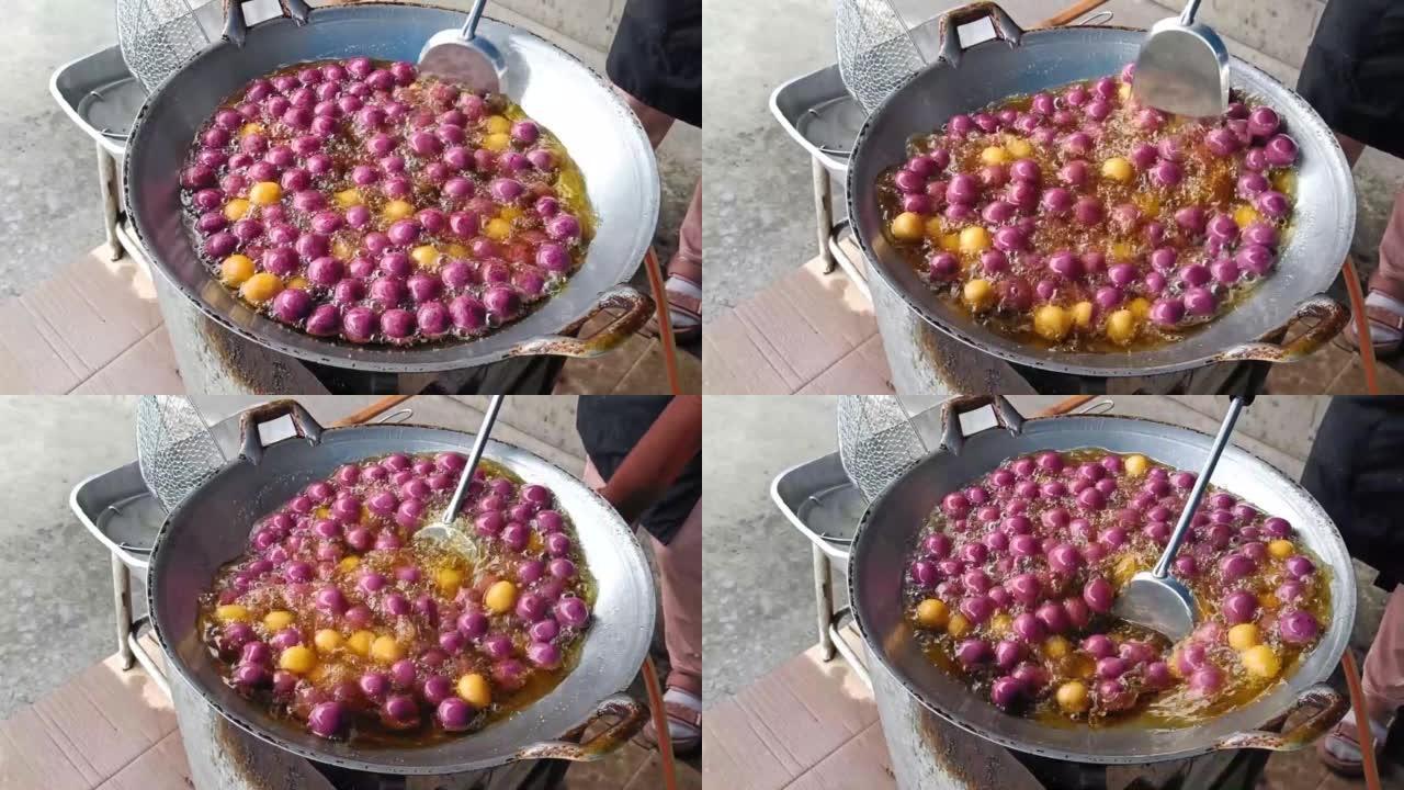 烹饪红薯球或泰语叫Khanom khai nok kratha。由红薯和面粉制成的模具球