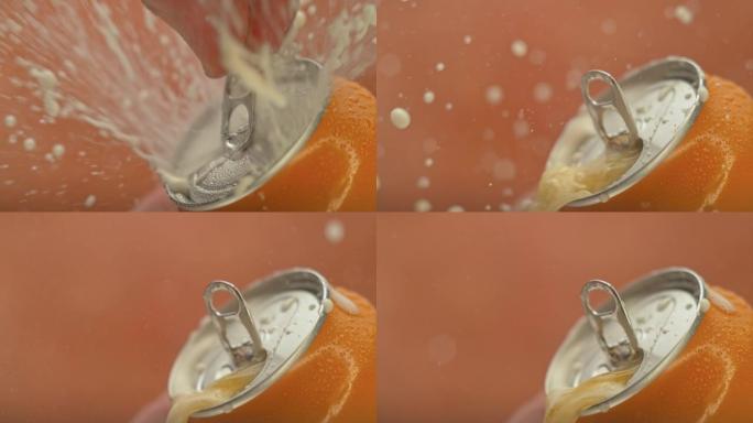 SLO MO LD手指打开橙色的罐，液体开始飞溅