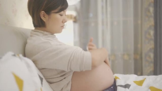 垂直，孕妇正在预防妊娠纹