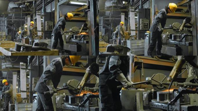铸造厂的DS男工人通过衬里在金属铸件上工作