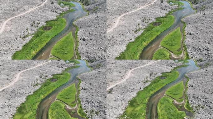 在充满活力的河流上的鸟瞰图穿过崎terrain的地形
