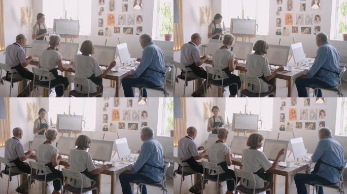 老师在绘画课程中展示了一群退休老人的朋友。一群老年男女相聚微笑