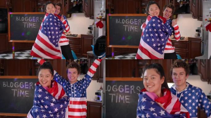 实时摄像机放大到微笑开朗的亚洲女孩，包裹在美国国旗上，高加索男孩在背景下打手势成功。快乐满意的积极博