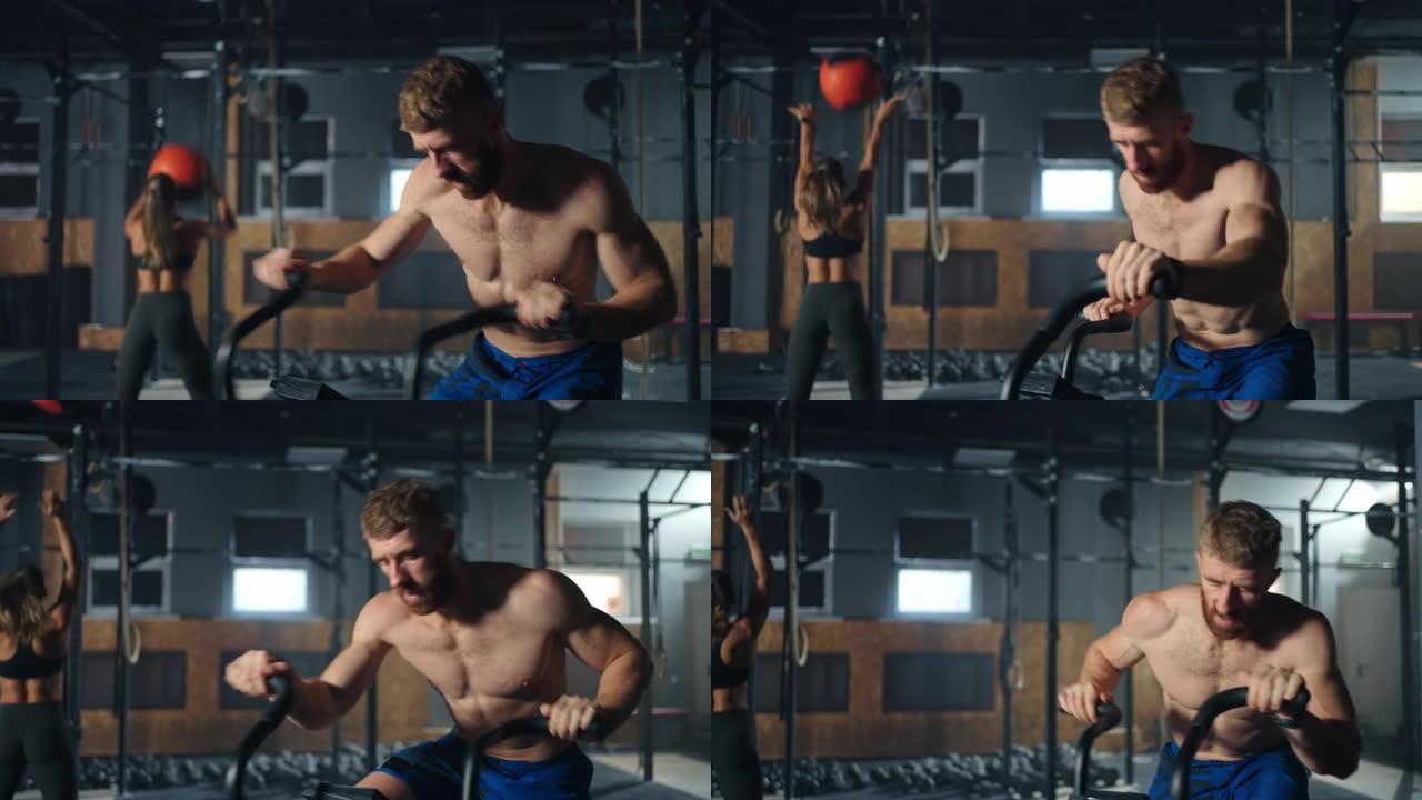 运动员在带手柄的运动自行车上训练，在健身房进行积极的剧烈锻炼，肖像