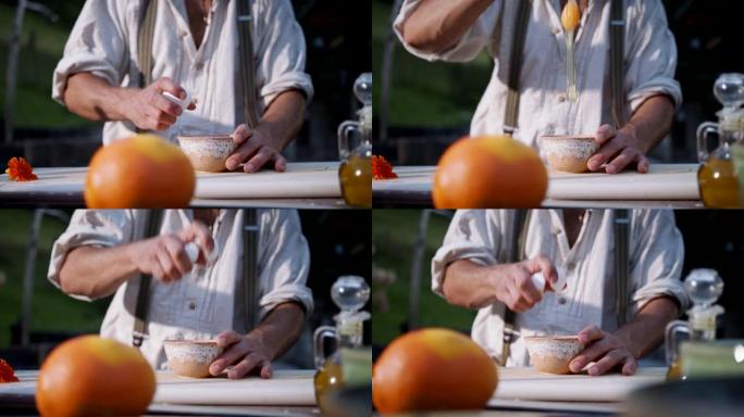 一名男子将鸡蛋打入碗中的慢动作镜头