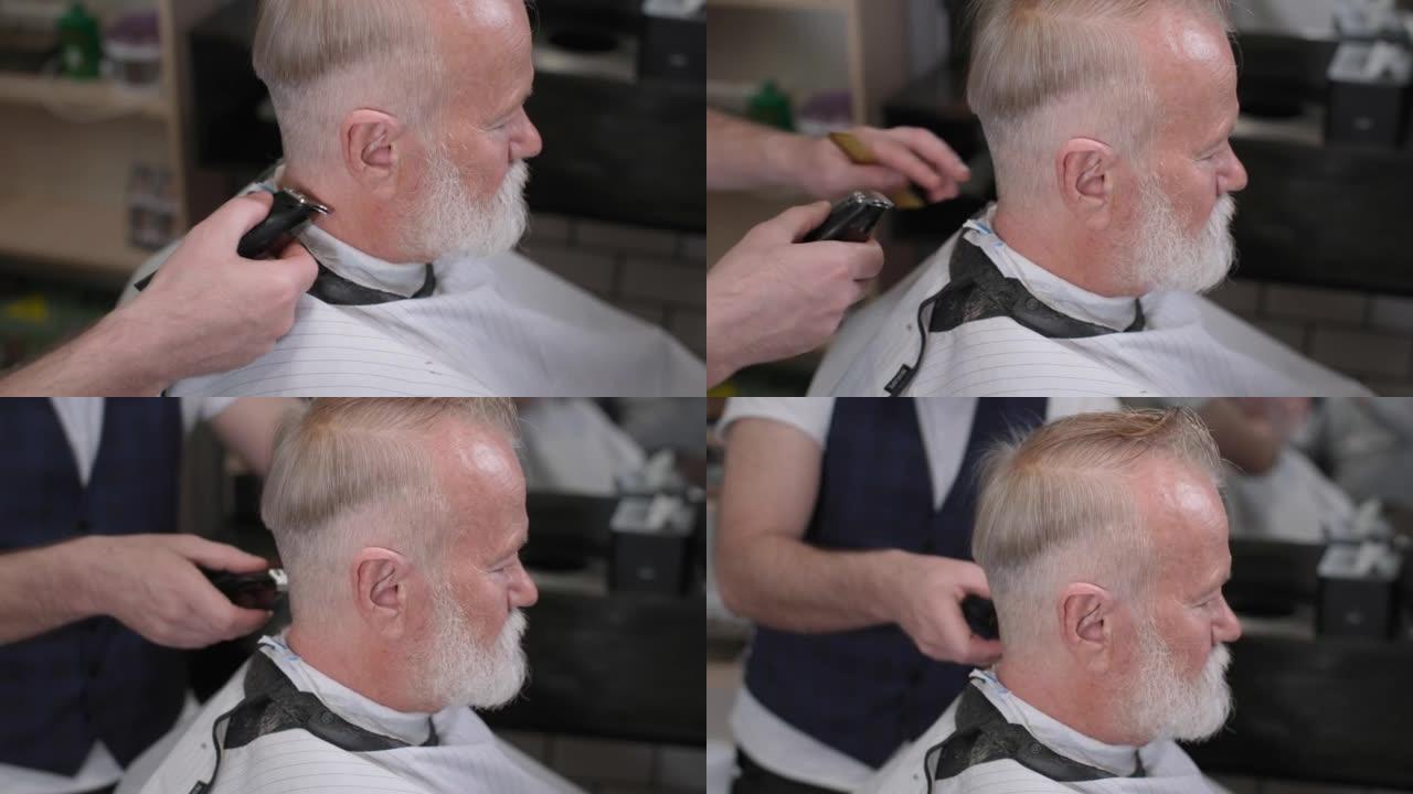 男士沙龙，一个留着胡子的老男人在时髦的理发店里用理发师剪了一个现代的发型