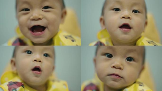 CU: 可爱的男婴 (6-11个月) 看着相机笑