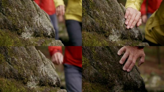 徒步旅行时徒步旅行者将手放在岩石上的细节镜头
