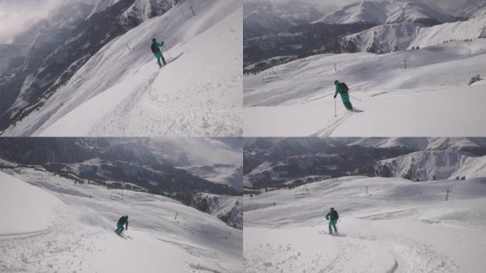 一名滑雪者从白雪皑皑的山坡上下来拍摄后