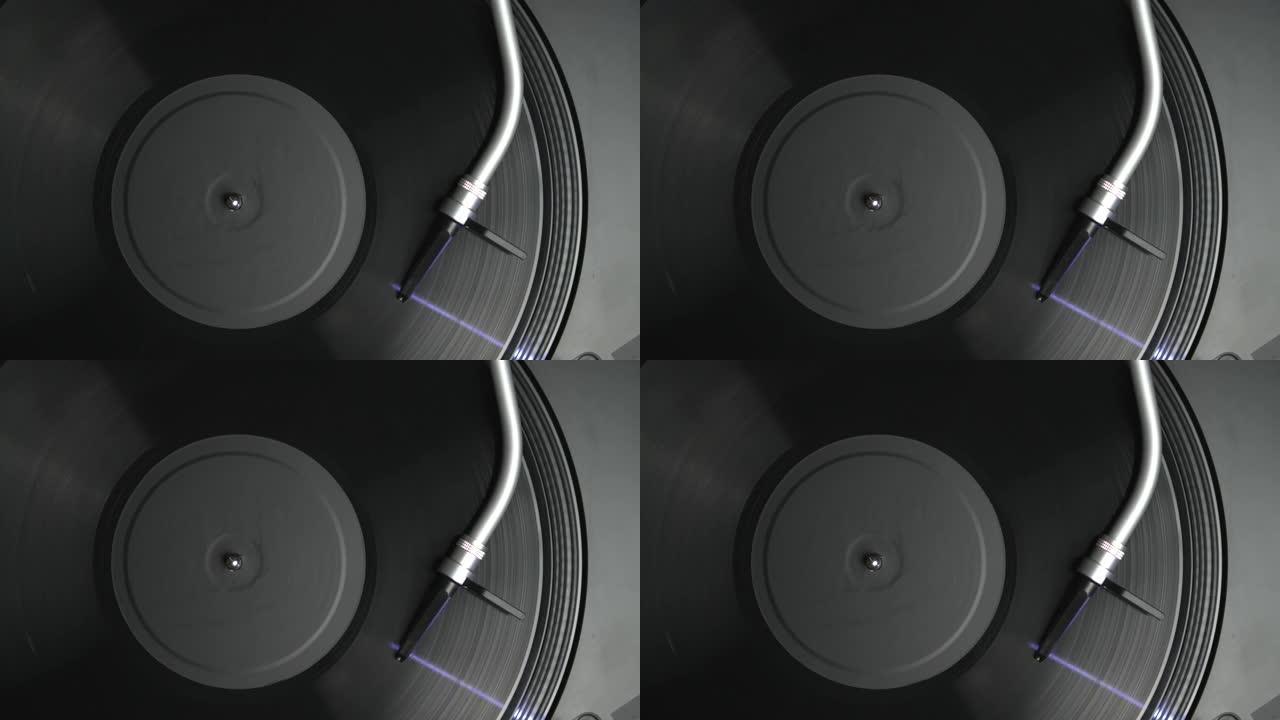带有球形针的转盘音臂在头顶视频剪辑中播放带有音乐的乙烯基唱片，直接从上面拍摄到4k