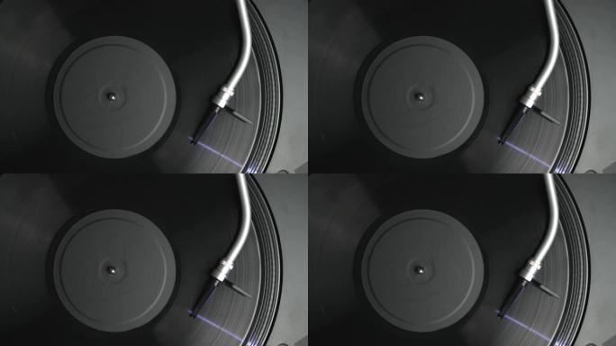 带有球形针的转盘音臂在头顶视频剪辑中播放带有音乐的乙烯基唱片，直接从上面拍摄到4k