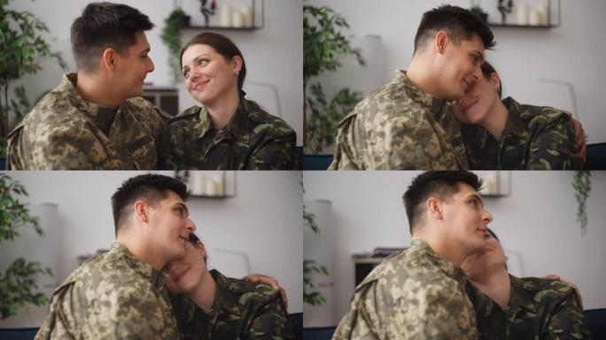 快乐的军人夫妇拥抱交谈，享受一起在家的时光