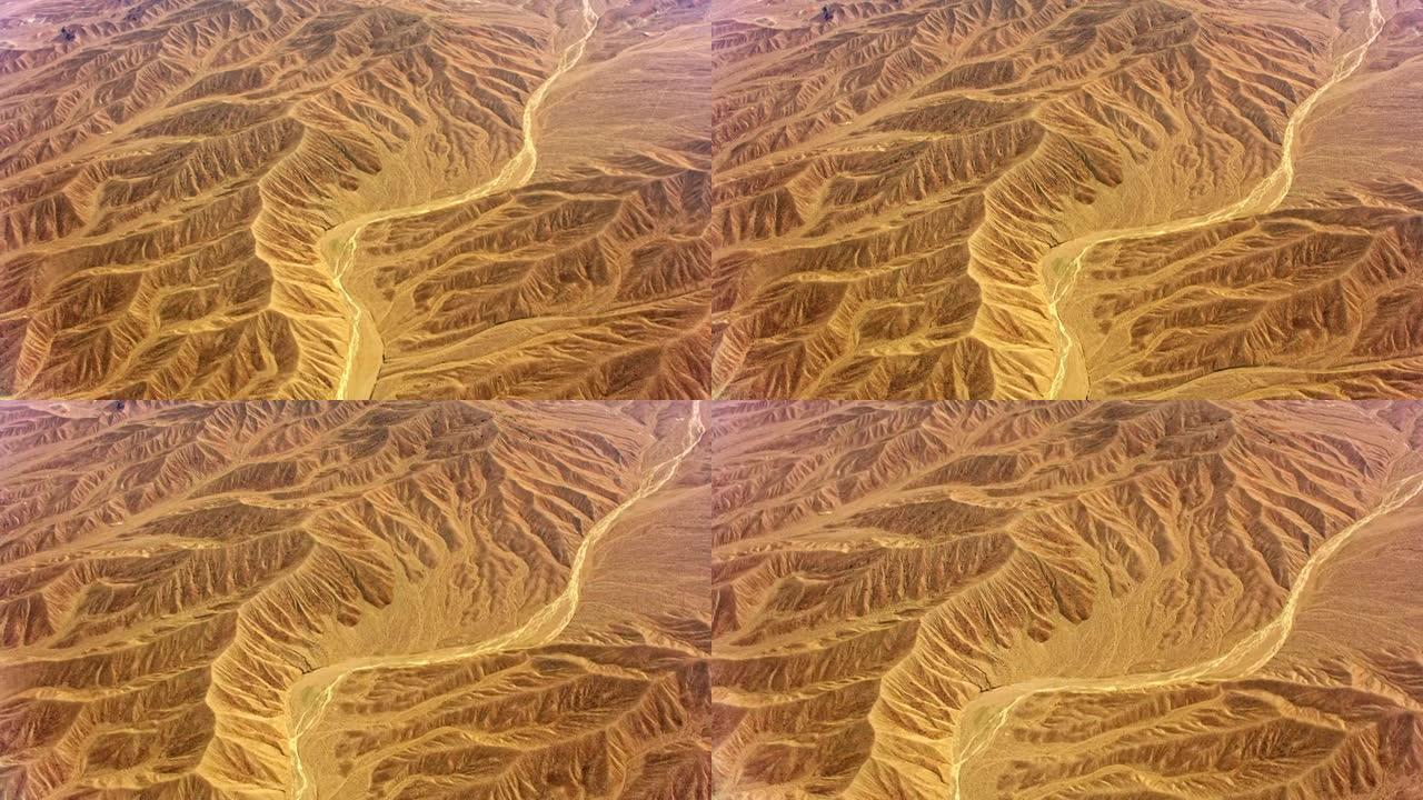 美国加利福尼亚州沙漠中带有干燥河床的空中沙漠山脉