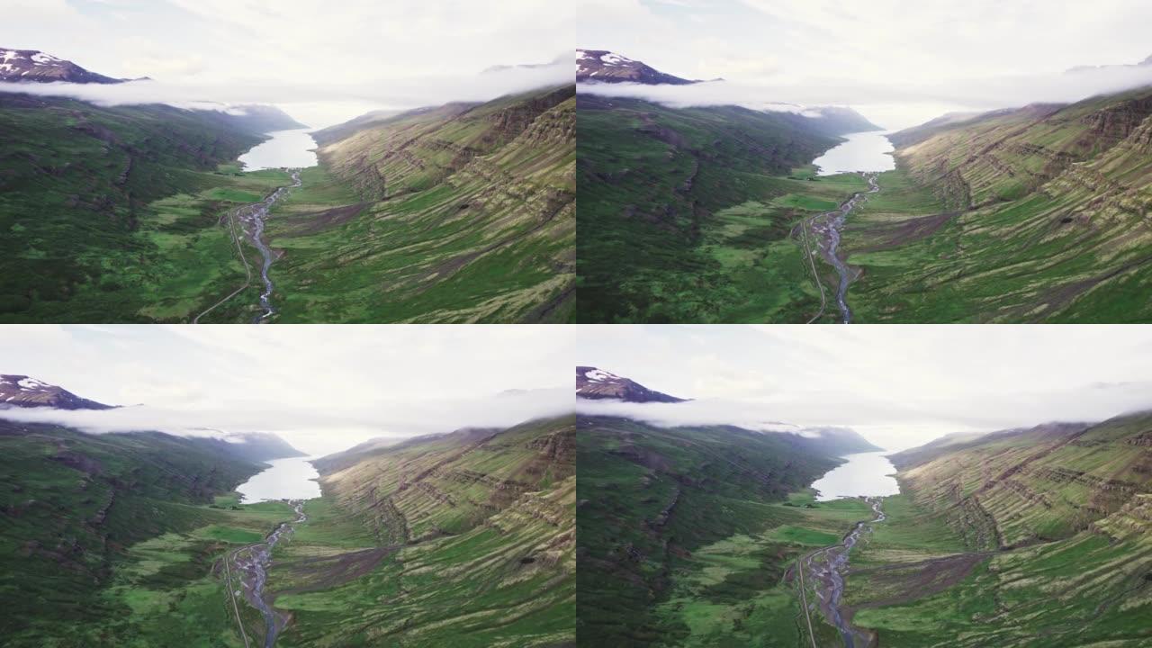 在Fjord mj ã ³ ifj ã r ã ur进行探索，海洋上有雾，在冰岛东部的山谷中流淌着土