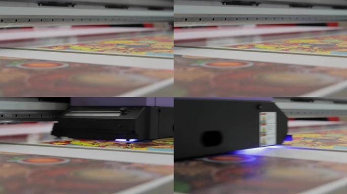 现代数字大幅面紫外打印机。印刷生产技术。UV钉扎是将一定剂量的低强度紫外线施加到UV可固化油墨上的过