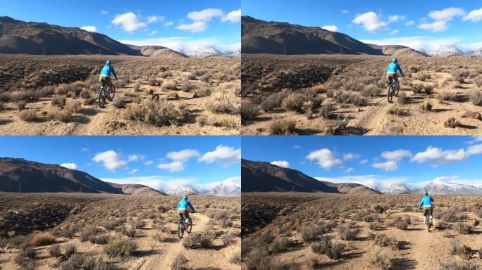 女山地自行车手沿着沙漠小路行进