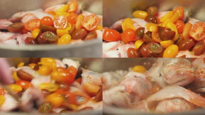 厨师烹饪鱼和西红柿的详细照片