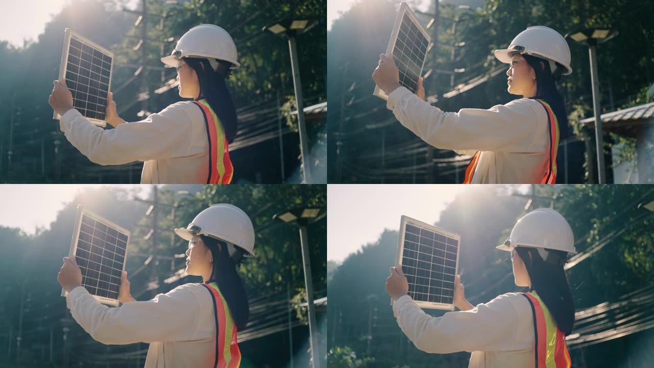 在现场广播中交谈的女工程师在电力无法到达的农村地区安装太阳能电池板