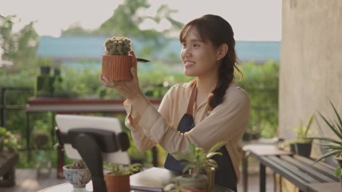 年轻的亚洲女子有直播卖仙人掌