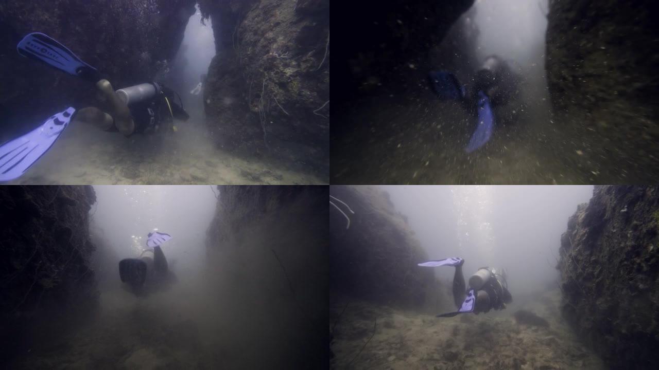 潜水员接近海底的珊瑚礁