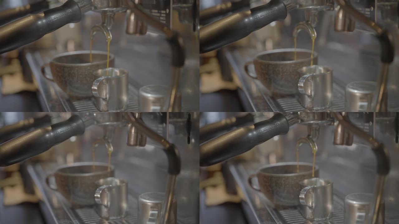 咖啡从浓缩咖啡机滴入杯子的细节照片