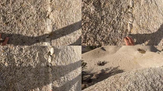 人类手攀登沙漠巨石的细节